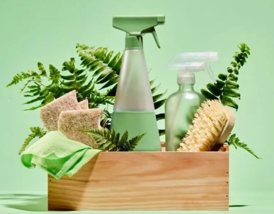 Eco-friendly cleaning kit with bottles, brushes, and sponges