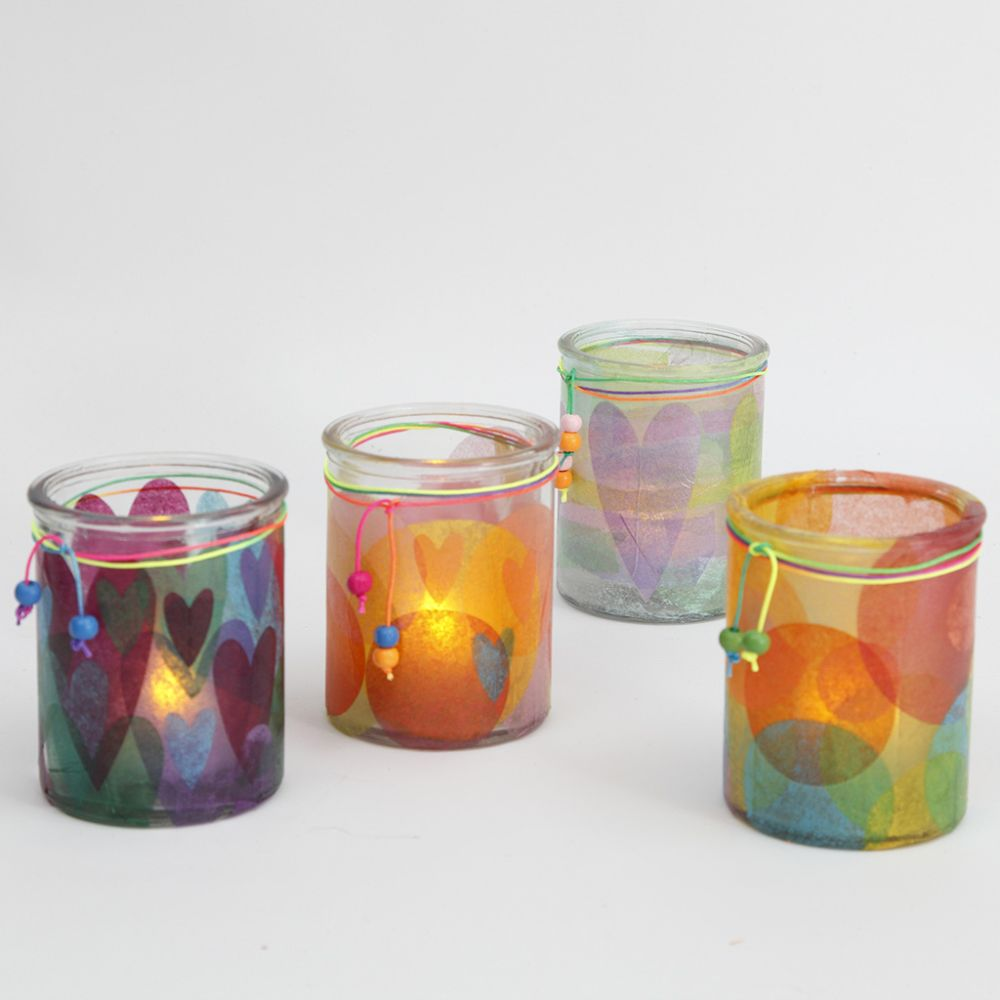 Decorated candle holders on a white background.