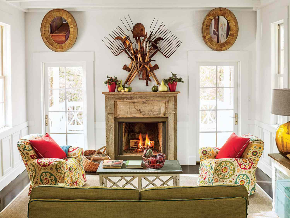 Rustic living room fireplace decorated with vintage garden tools and cozy seating