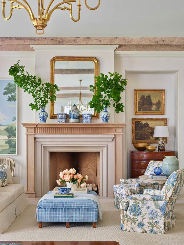 Elegant fireplace styling with mirror, vases, and affordable seasonal floral décor