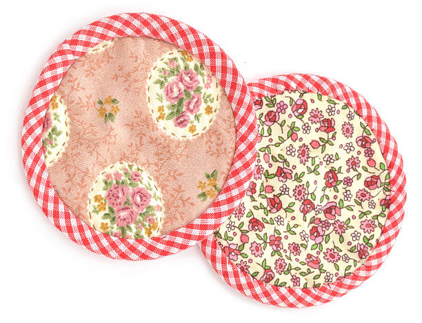 Round coasters over a white background.