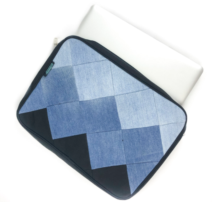A hand stitched denin laptop bag.