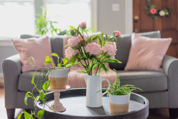 Pink flowers on a coffee table.