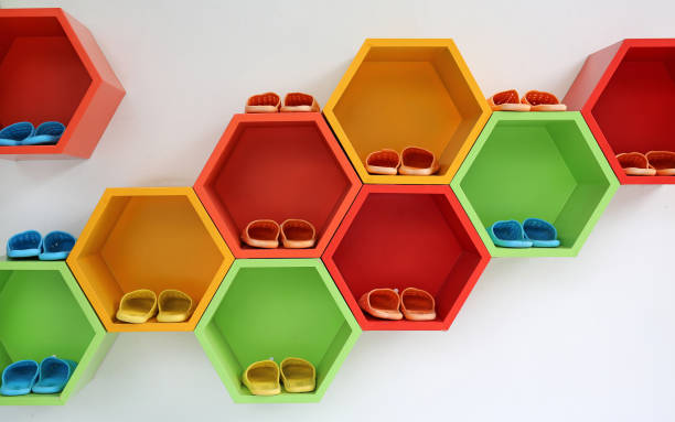 Colorful sneakers neatly displayed on a white shelf