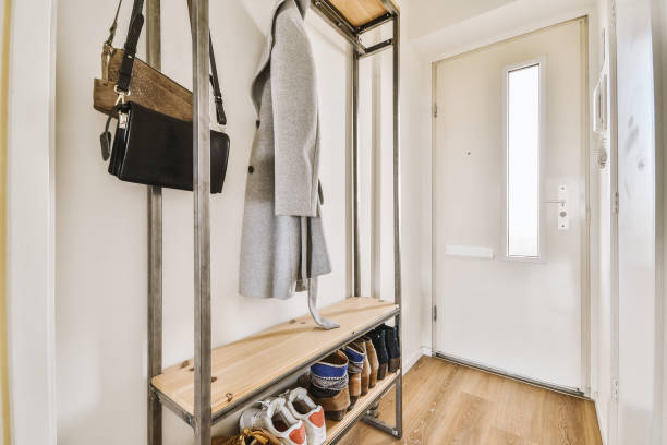 Entryway storage with coat hooks and wooden shoe bench