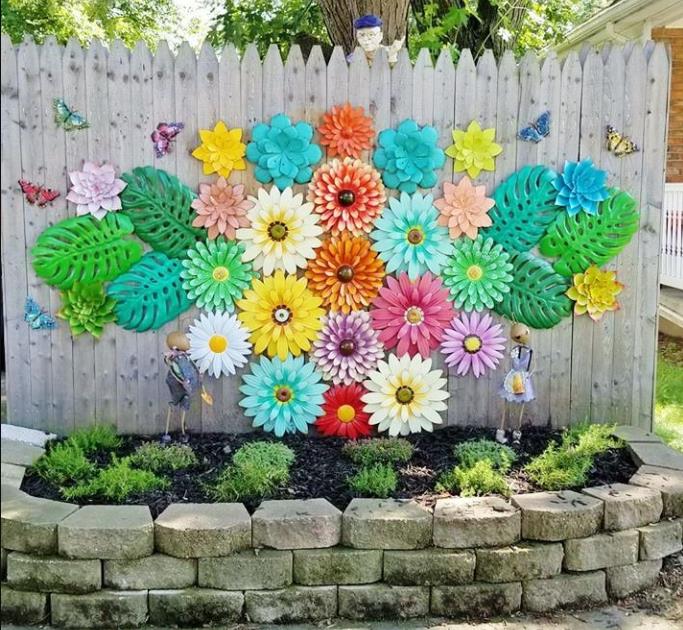 Wooden garden fence decorated with colorful 3D flower art