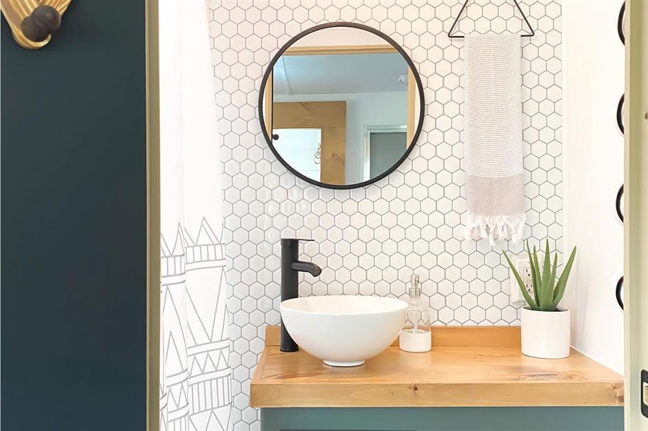 Wall-mounted hooks holding bath items and towel