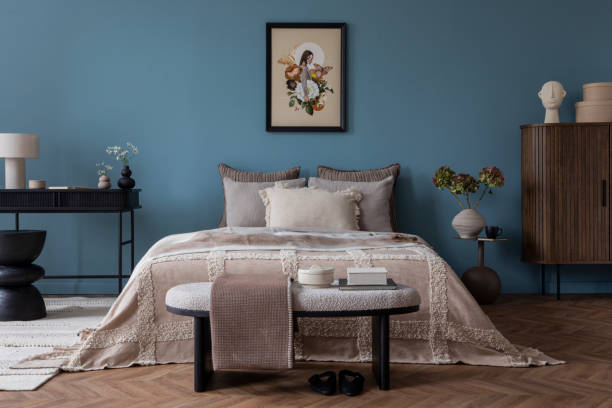 Elegant bedroom with blue walls and decorative accents