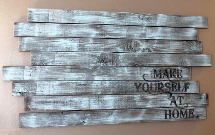 Rustic wood wall decor with 'Make Yourself at Home' text
