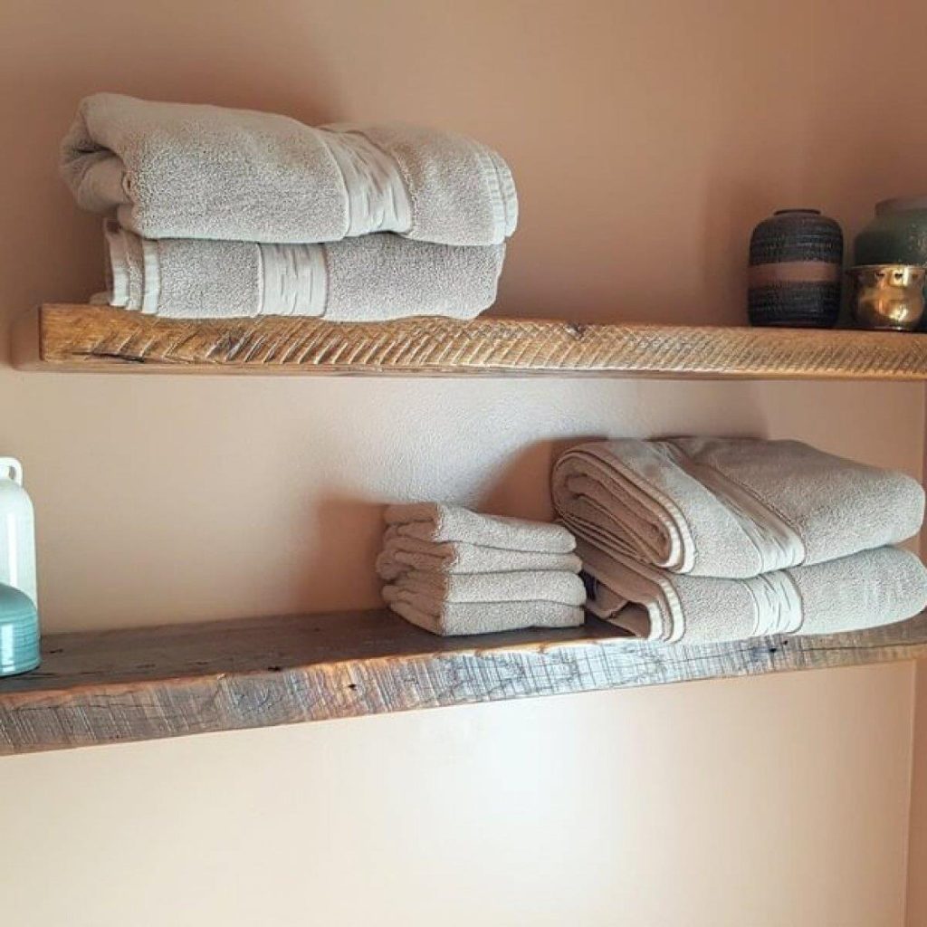 Rustic bathroom shelves with towels and decor