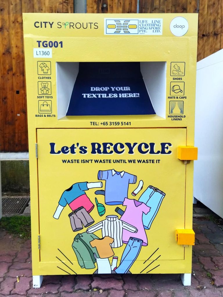 Yellow textile recycling bin for clothing donations