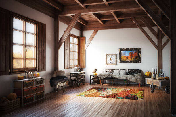 Cabin-style interior with wooden beams, colorful rug, and cozy furniture