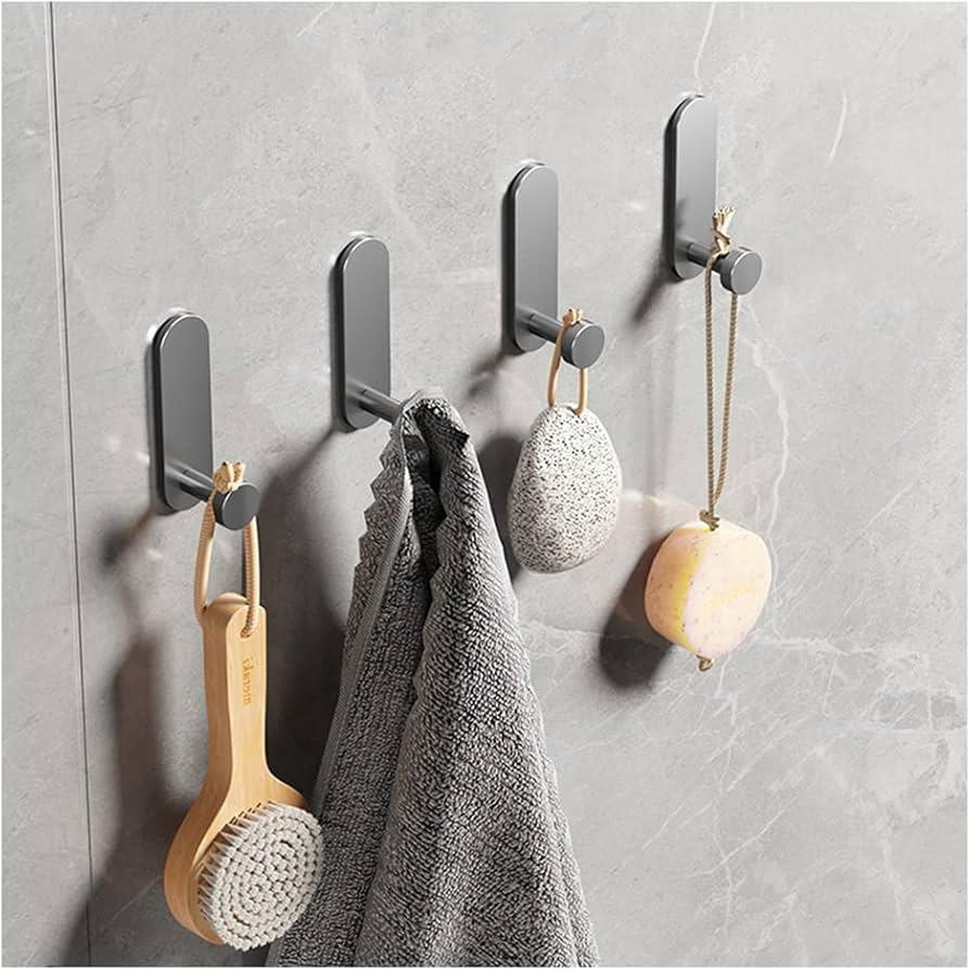 Wall-mounted hooks holding bath items and towel