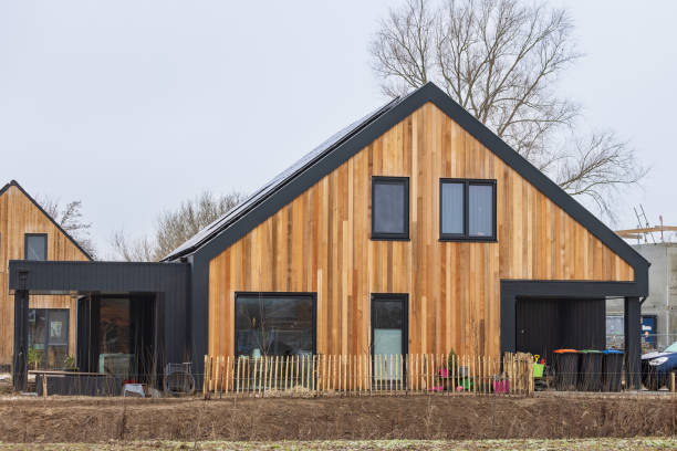 Contemporary wooden house with a gabled roof and large windows