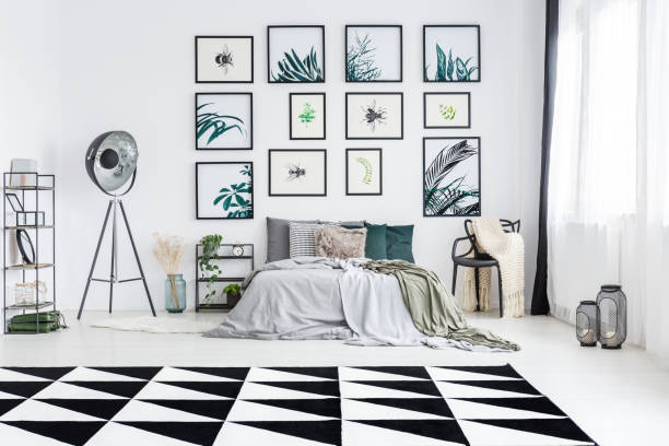 Scandinavian bedroom with black-and-white decor and wall frames