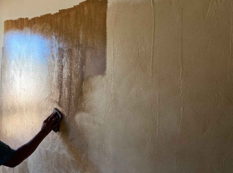 Glazing over texture on wall to highlight it even more.