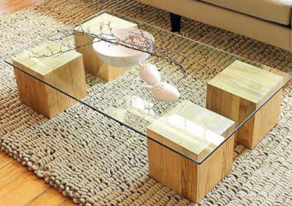 Glass coffee table with wooden blocks