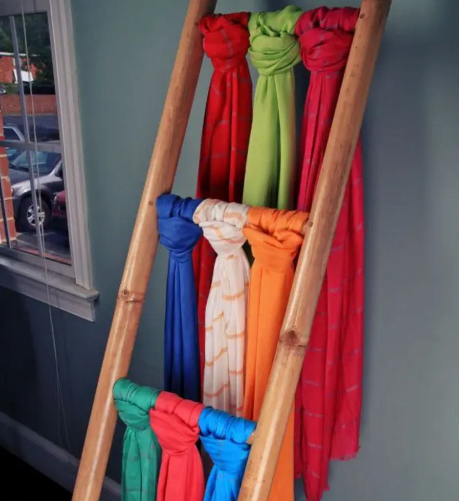 DIY wooden ladder used as scarf holder for creative scarf storage and bedroom decor ideas