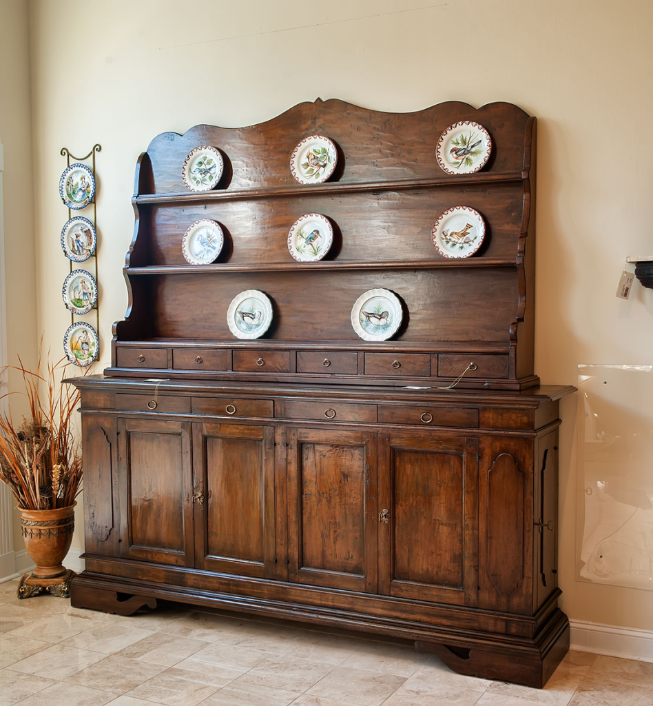 antique wooden hutch cabinet with rustic farmhouse style and decorative plate display
