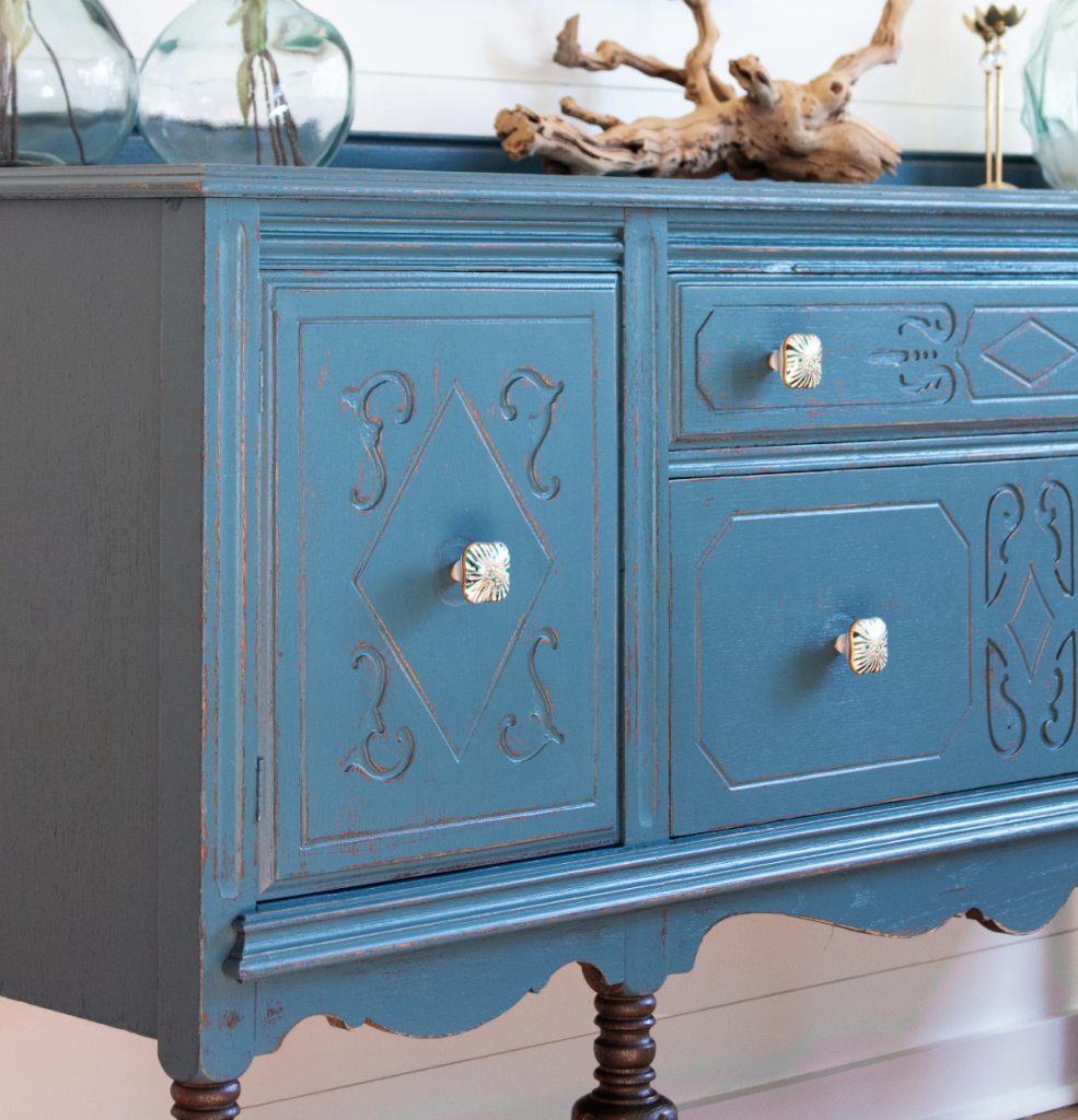 blue distressed vintage cabinet makeover with decorative details and rustic farmhouse finish
