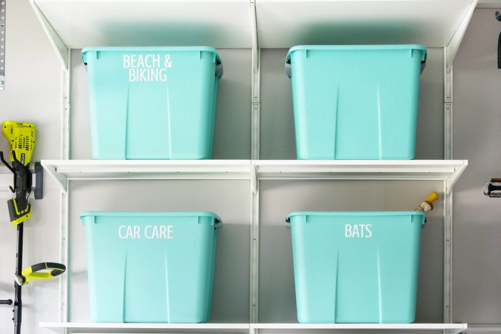 labeled storage totes on wall shelves for efficient garage storage organization ideas