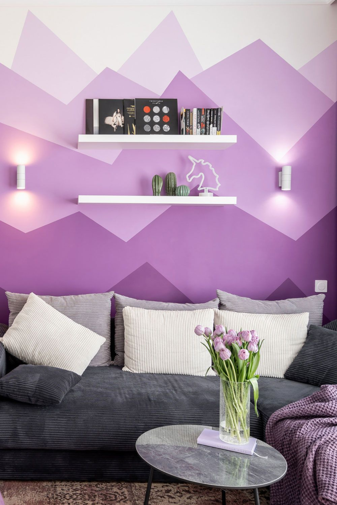 purple geometric accent wall design in cozy modern living room interior