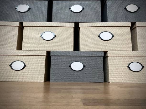 Stacked fabric storage boxes with label holders for organized closet and home storage