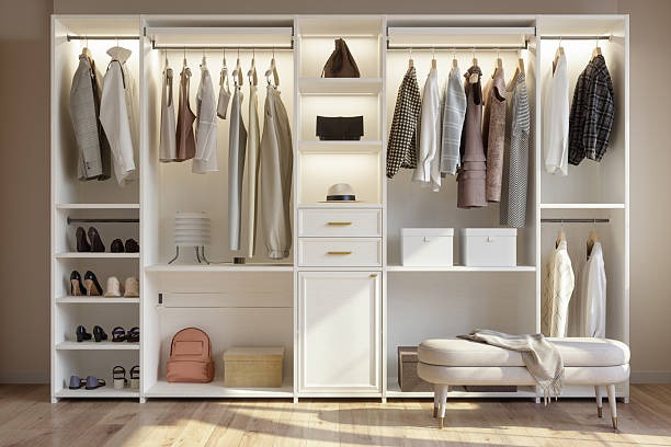 modern walk in closet system with shelves drawers and hanging clothing storage