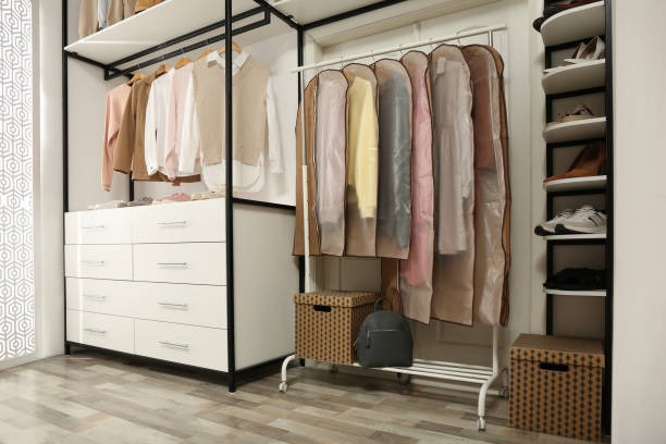 open closet storage system with garment bags drawers and shoe shelves