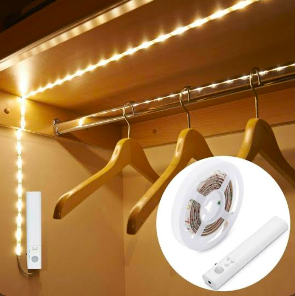 A motion detector led light strip in an empty closet showcasing its usefulness.