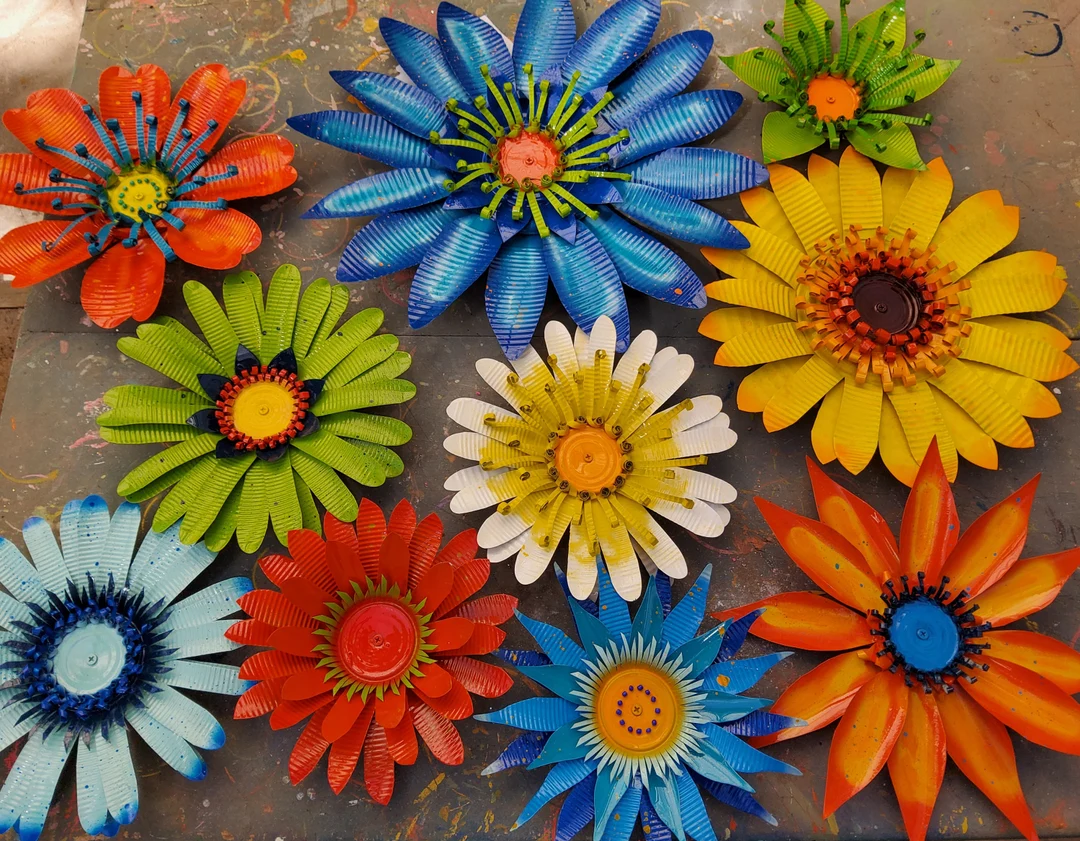 A top down view on various blossoming flowers created from scrap metals.