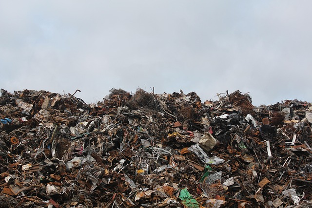 A landfill piled high into the sky with various scraps that can be used in repurposed art.