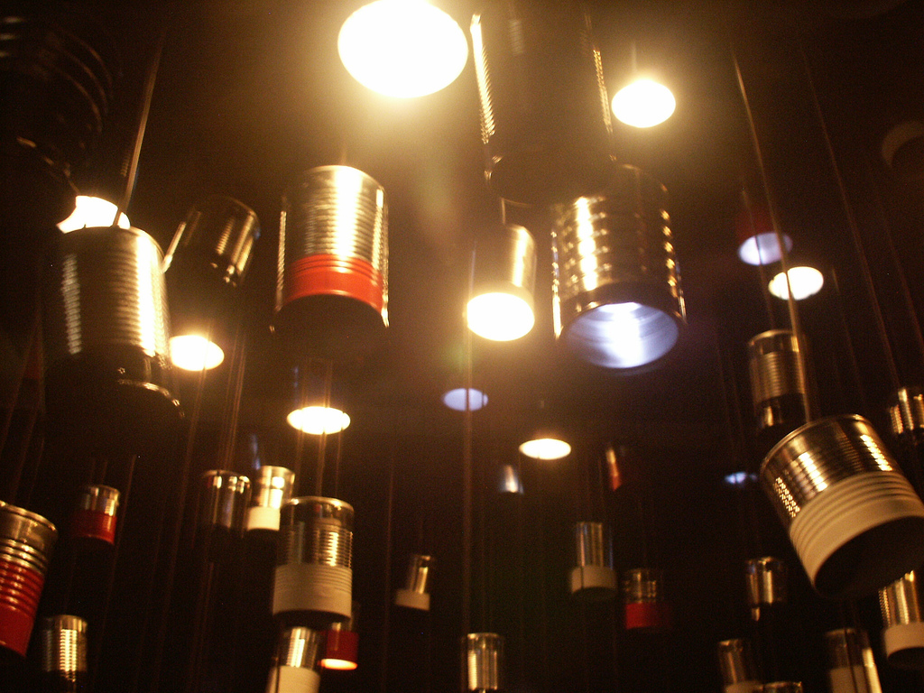 A bunch of repurposed paint cans hung up as lights.