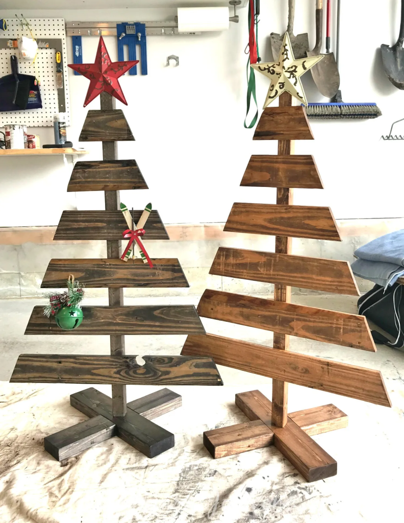 DIY wooden Christmas trees made from pallet wood with star toppers