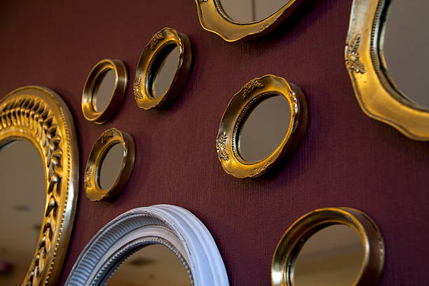 Upcycled frames on a red wall.