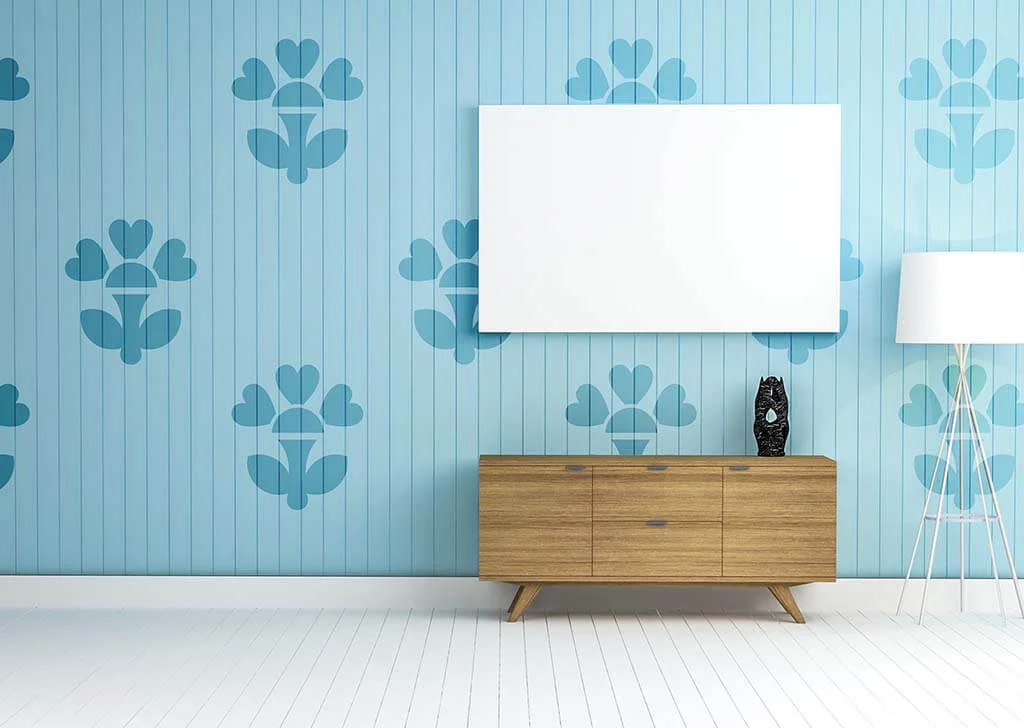 Stencil art on a paneled wall.
