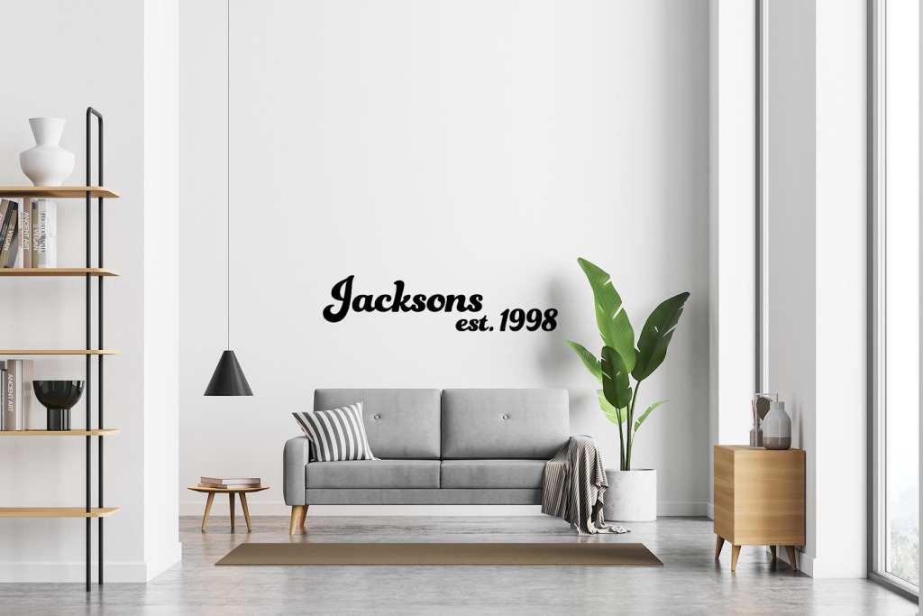 Removable vinyl on a plain white wall adding character to a living room.