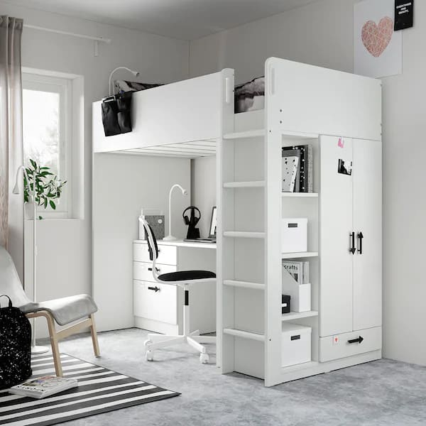 A upper bunk bed lower desk and closet combo multipurpose piece of furniture.