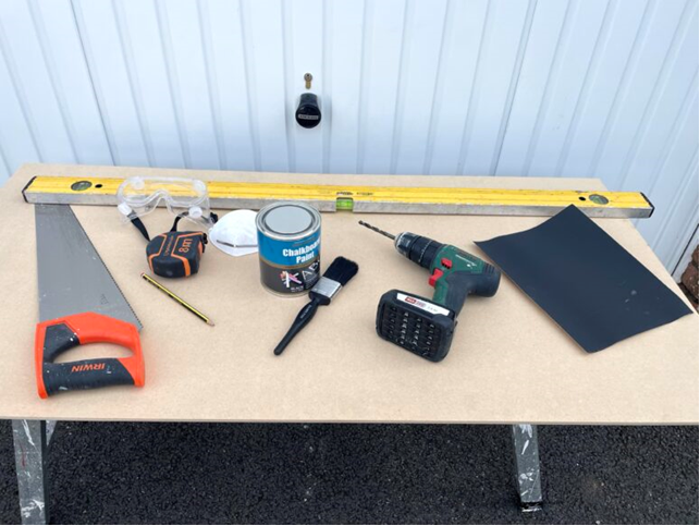 Tools laid out on a workers bench.
