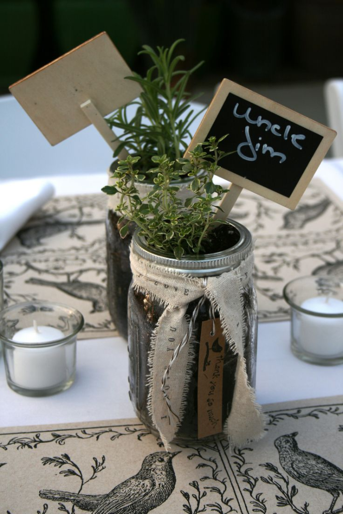 Mason-jar herbs with chalkboard labels.