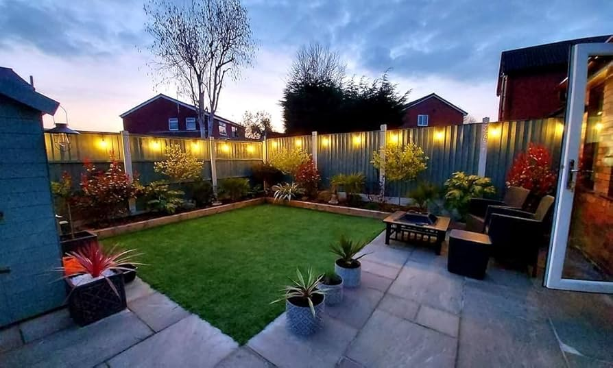 A backyard with led lighting on the fence and a relaxing ambiance.
