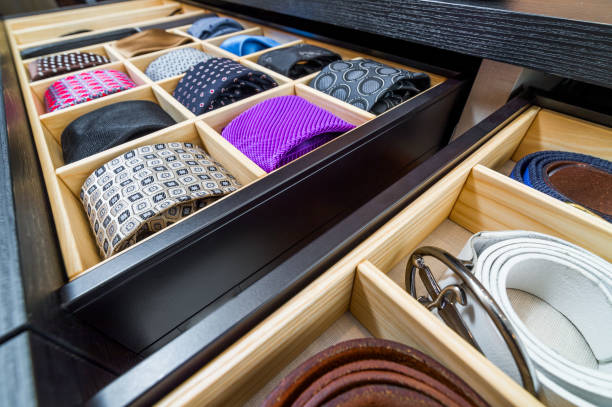 Belt and tie organizer in drawers.