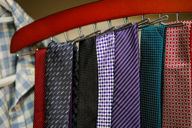 A collection of ties hung in a wardrobe