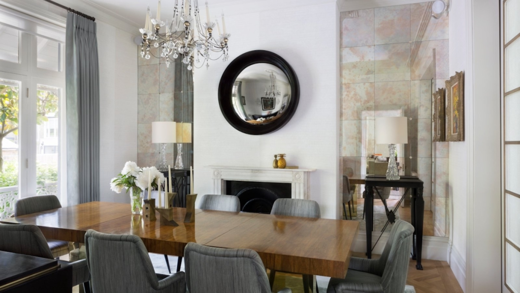 Mirrors brightening and enlarging this modern dining room