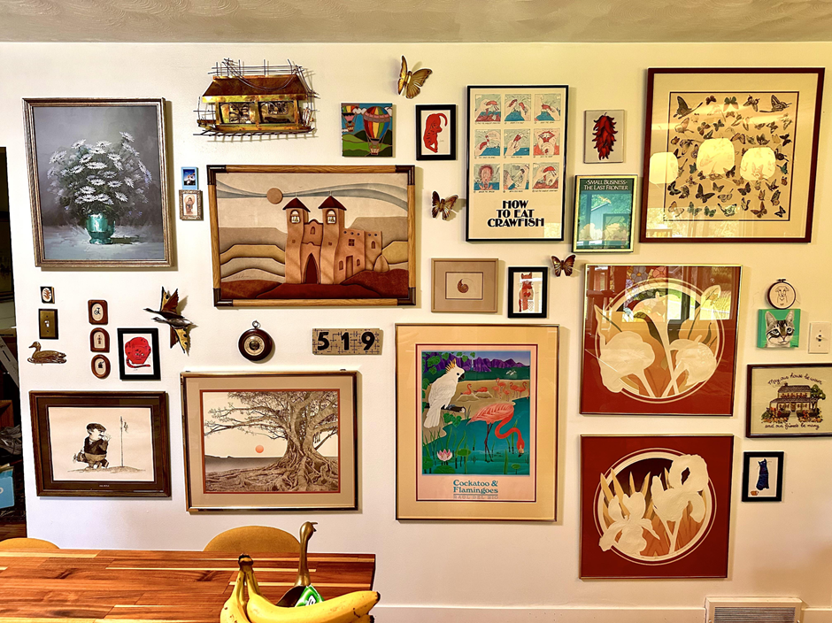 DIY picture collage with assorted frame styles on a bedroom wall