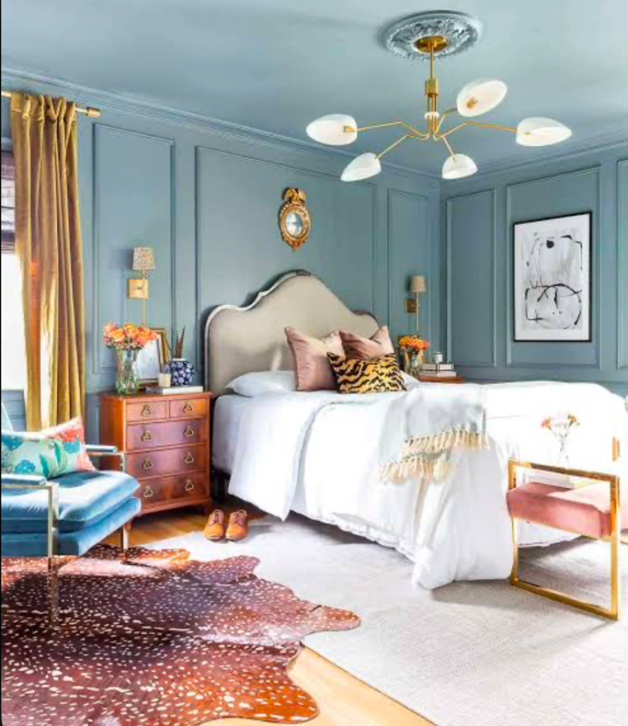 Cozy bedroom with soft lighting and neutral-toned bedding