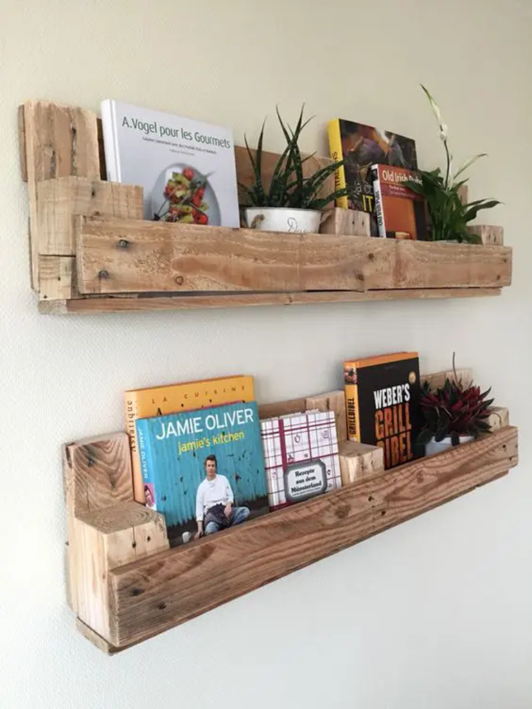 Rustic wooden wall shelves displaying books and small indoor plants