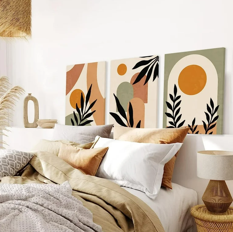 a bed with pillows and a lamp