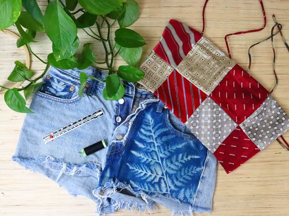 DIY upcycled jean shorts with leaf print and patchwork pouch.