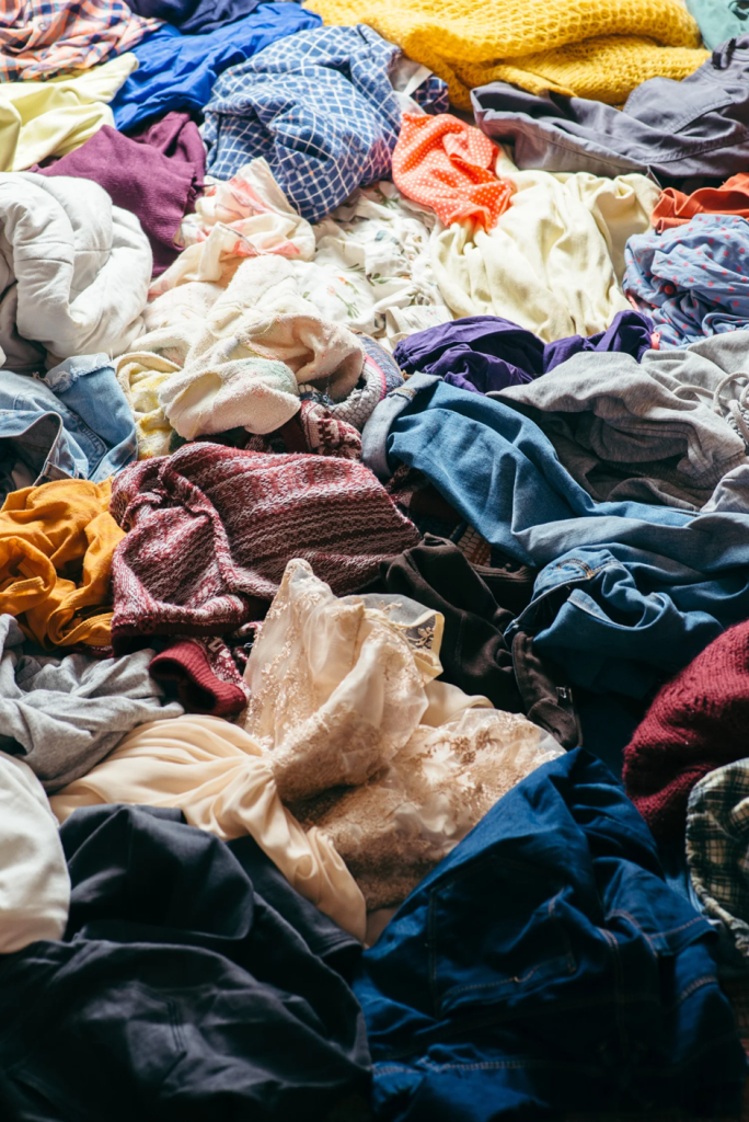 Pile of old clothes for donation, recycling, or upcycling.
